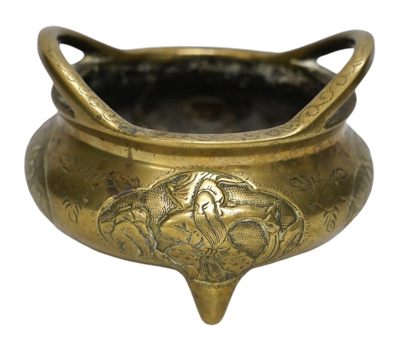 A Chinese bronze tripod censer, Xuande mark, 19th century, 13cm wide. Condition - plug repair to body